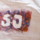 FSJ - Buchstaben mit Farben auf einen Jutestoff gemalt